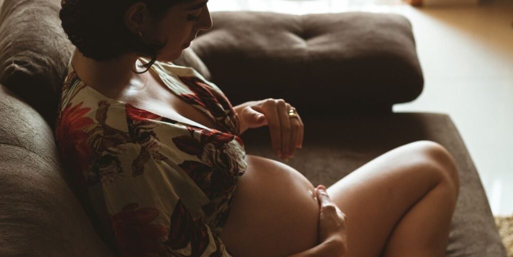 pregnant woman on sofa