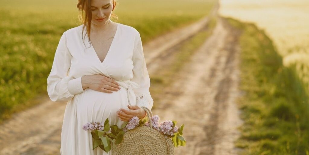 pregnant woman carrying a basket