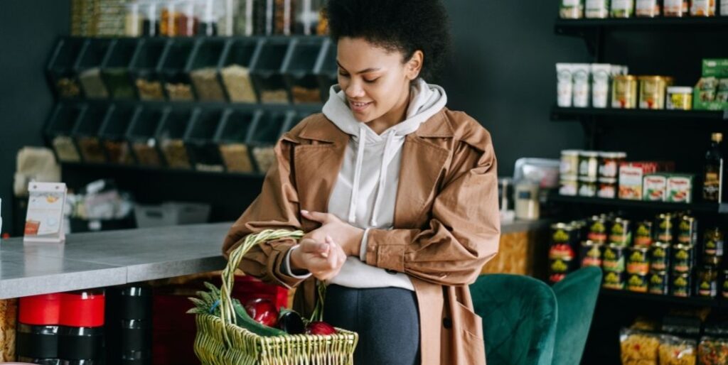 pregnant woman shopping for produce